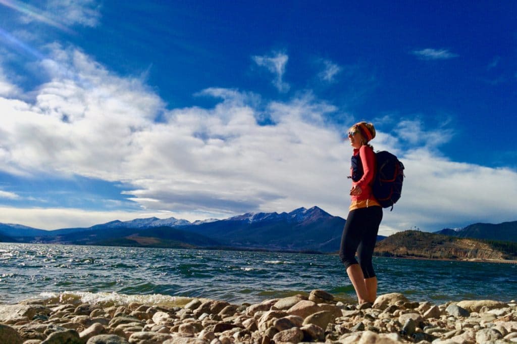 Heidi standing on the shore of Lake Dillon